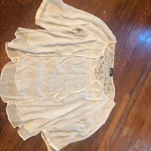 White blouse cuff sleeves lace on back